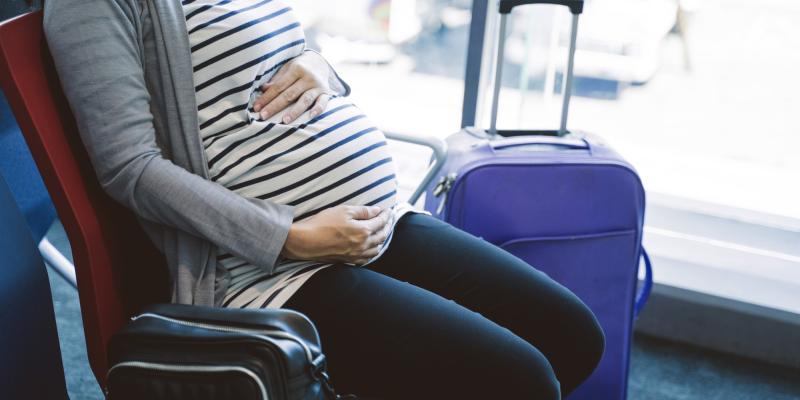 What precautions should pregnant women take on holiday?